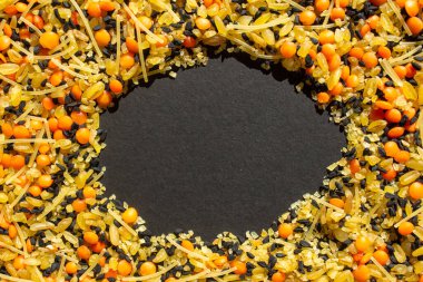Various dried foods isolated on a black background. Top view of legumes with copy space for text. High protein foods. Flat lay.