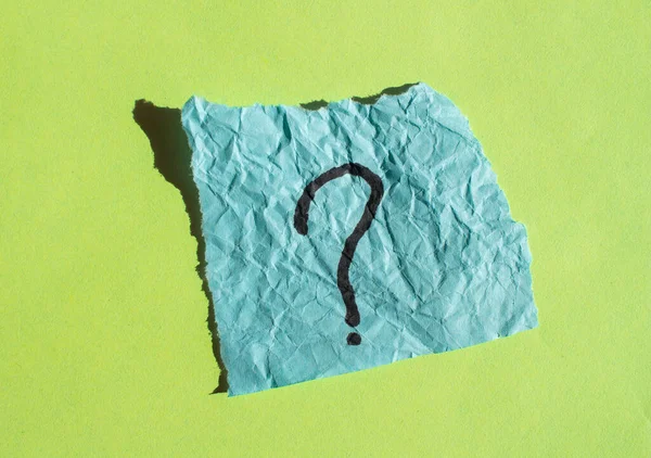 Question mark drawn on a paper. Curiosity, uncertainty and confusion concepts. Conceptual image.