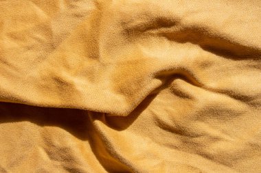 Yellow fabric texture background. Textile background photo.