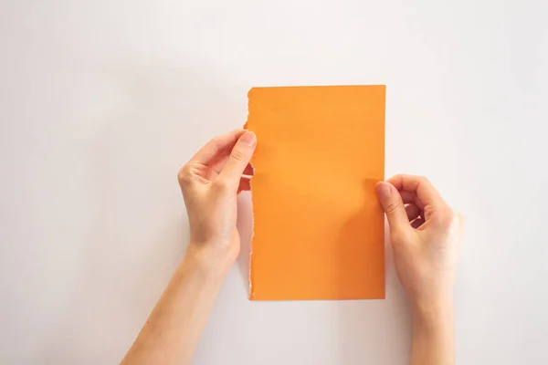 Hand Holding Blank Paper Top View — Stock Photo, Image