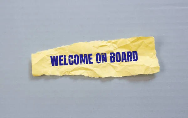 Welcome on Board written on torn paper. Business concept background.