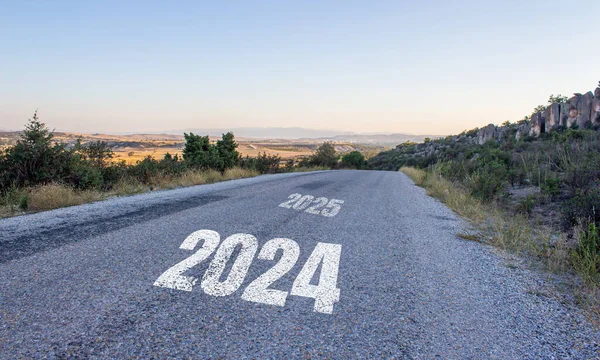 stock image 2024 written on asphalt road. New year 2024 concept photo. New year new beginnings.