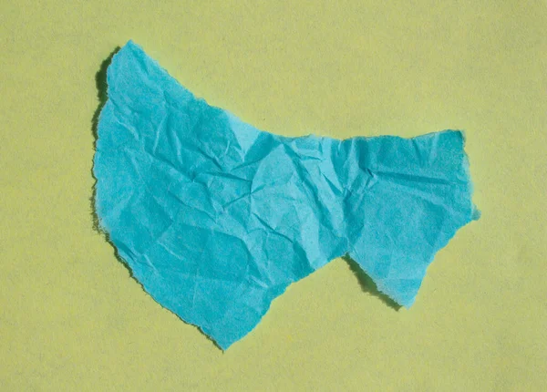 Creased Blue Paper Piece Yellow Background Crumpled Torn Paper Edge — Stock Photo, Image