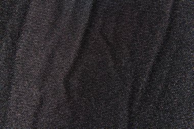 Siyah kumaş dokusu arka planda. Tasarımlar için siyah boş yüzey.