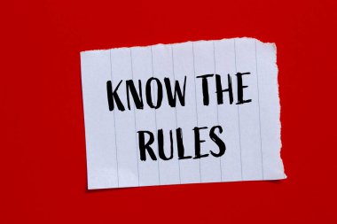 Know the rules words written on ripped paper with red background. Conceptual know the rules symbol. Copy space. clipart