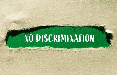 No discrimination words written on ripped paper with green background. Conceptual no discrimination symbol. Copy space. clipart