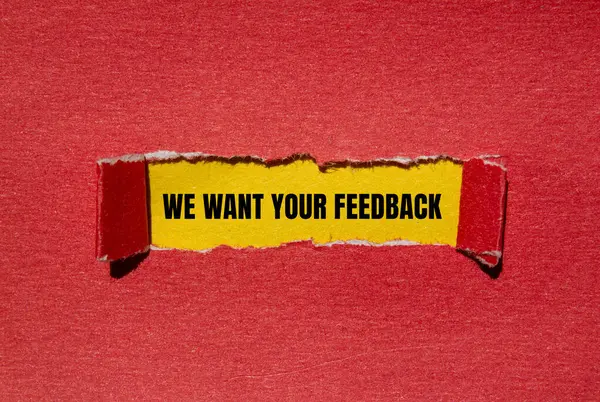 stock image We want your feedback message written on ripped torn red paper with yellow background. Conceptual we want your feedback symbol. Copy space.