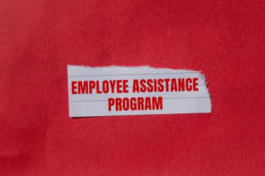 Employee assistance program message written on ripped torn paper piece with red background. Conceptual employee assistance program symbol. Copy space. clipart