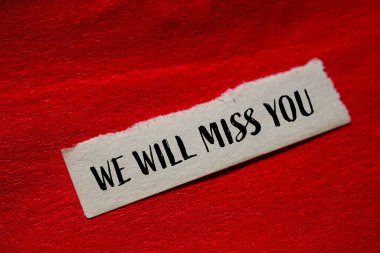 We will miss you message written on torn paper with red background. Conceptual we will miss you symbol. Copy space. clipart