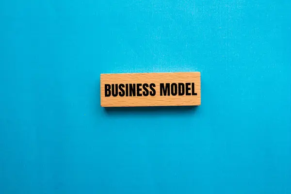 stock image Business model message written on wooden block with blue background. Conceptual business model symbol. Copy space.