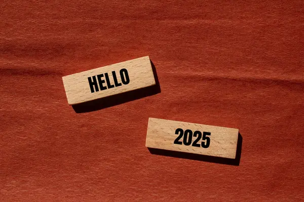 stock image Hello 2025 message written on wooden blocks with brown background. Conceptual hello 2025 symbol. Copy space.