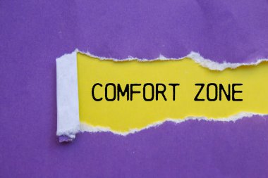 Comfort zone message written on ripped torn purple paper with yellow background. Conceptual comfort zone symbol. Copy space. clipart