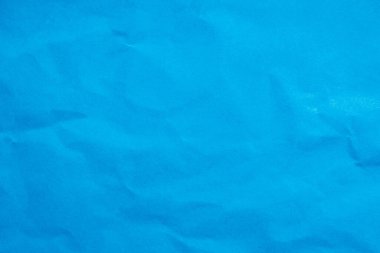 Buruşmuş mavi kağıdın arka planı buruşmuş doku