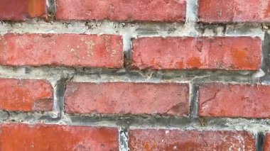 Kırmızı tuğladan arkaplanı olan tuğla duvar