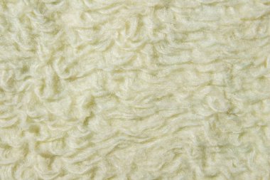 Yumuşak krem kumaş kumaş arkaplanı kabarık lif dokusu, dokunmuş malzeme yüzeyinin yakın çekimi. Tasarım, mobilya ve moda ayrıntıları için soyut döşeme kumaşı deseni