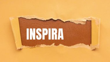 Inspiration message written on ripped torn paper background. Conceptual Inspiration symbol.