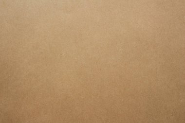 Brown kraft paper texture background. Natural recycled cardboard surface with subtle fiber details, perfect for packaging, eco-friendly design projects and craft applications.