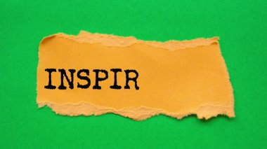 Inspiration message written on ripped torn paper background. Conceptual Inspiration symbol.