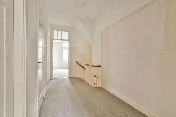 Interior of empty white room with windows with parquet and radiator
