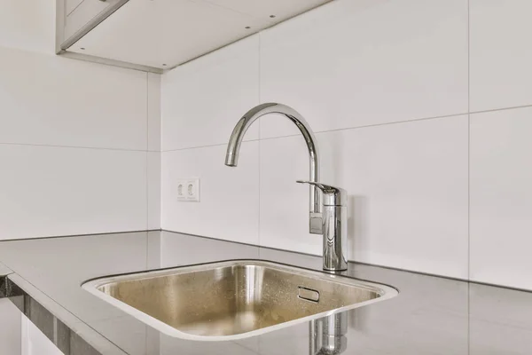 stock image Interior of empty white kitchen with windows and wooden parquet floor