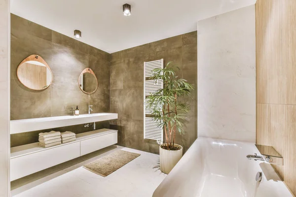 stock image White ceramic sink and mirror with illumination in bathroom designed in minimal style