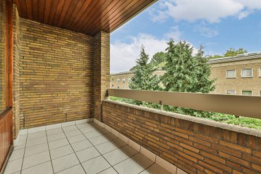 Panoramic view of buildings with trees from small balcony