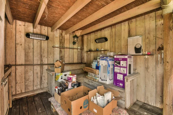 stock image Amsterdam, Netherlands - 10 April, 2021: the inside of a house with boxes on the floor and an open refrigerator in the door to the other room