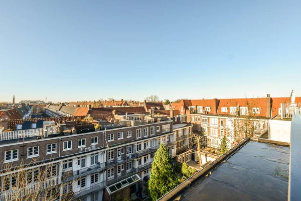 Amsterdam Holandia Kwietnia 2021 Obszar Miejski Budynkami Drzewami Czole Zdjęcie — Zdjęcie stockowe