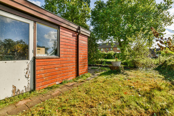 Amsterdam, Netherlands - 10 April, 2021: an old house that has been boarded up and is in need of repair, but its going to be replaced