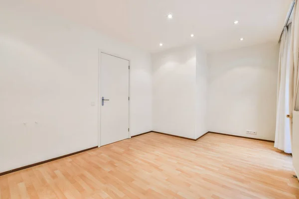 Empty Room Wood Flooring White Paint Walls Door Leads Another — Stockfoto