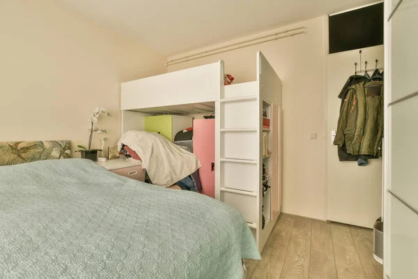 Bedroom Bed Closet Clothes Hanging Wall Next Open Door Leads — Stock Photo, Image