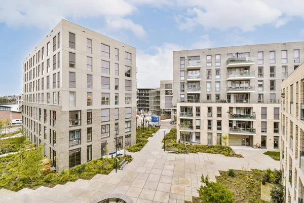 stock image an urban area with buildings and trees in the middle part of the photo is taken from the top floor to the ground