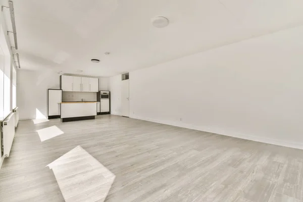 an empty living room with wood floors and white walls in the room is very clean, but there is no furniture