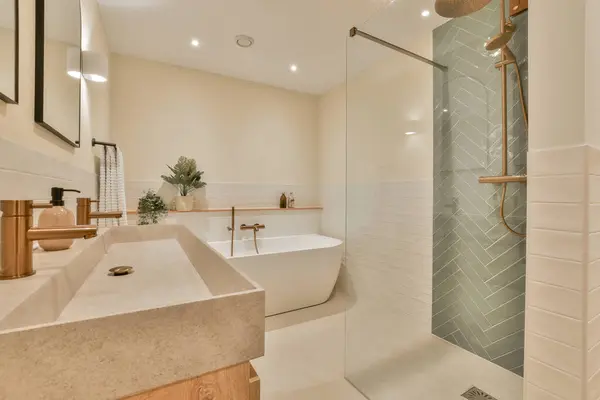 a bathroom with a bathtub, sink and shower in the background is an open door that leads to a walk - in shower