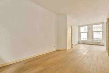 an empty room with wood flooring and white walls in the room is very clean, but there is no furniture