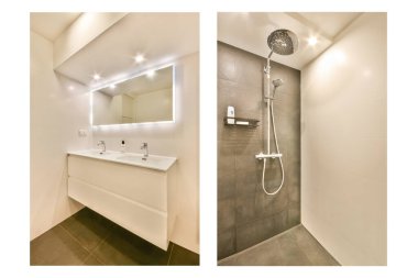 Hafif ışıklandırmayla aydınlatılan çift lavabolu gösterişli modern bir banyo ve yağmur başlıklı şık bir duş alanı..