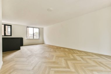 Geniş, modern bir iç mekan. Basit çizgileri ve açık renk paleti olan minimalist bir estetik. Çağdaş yaşam alanlarını göstermek için mükemmel.