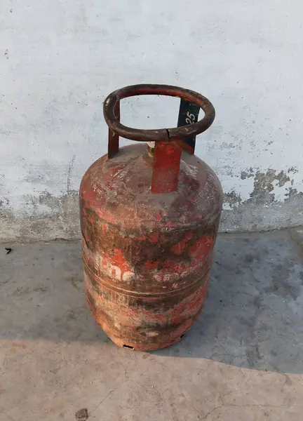 Indian Domestic LPG Gas Cylinder or Domestic Cooking gas Cylinder on land, gas cylinder on surface with spac