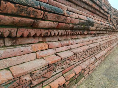 ancient brick wall cravings and ruined wall, 2500 years old ruins and design  clipart