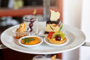 Mixed and assorted fruits tart with kiwi and grape for party or wedding, gastronomy, event organization concept.