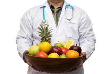 Doctor holding basket assort fresh fruits and vegetables isolated on white background.