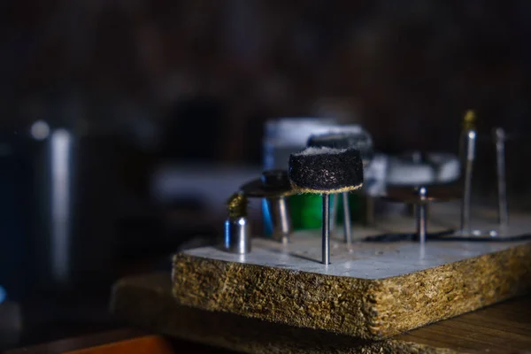 Stock image Closeup, metal engraving tools, watchmaker engraver work desk, selective focus