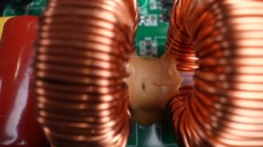 Disassembled electrical appliance close-up. Inductors in the inverter. Travel by trolley