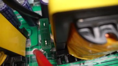 A disassembled electrical appliance close-up. Inductors with a fuse in the inverter. Travel by trolley