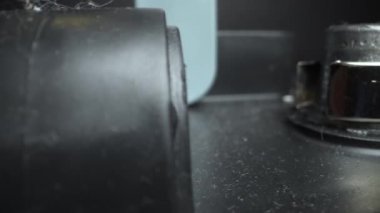 Clamps clips on a car battery. Travel by trolley. Slider movement