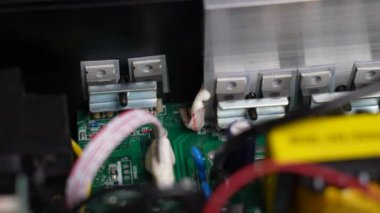 Disassembled electrical appliance close-up. Transistors with a radiator in the inverter