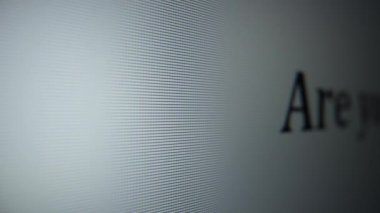 Are you doing anything. Moving text on a computer monitor close-up