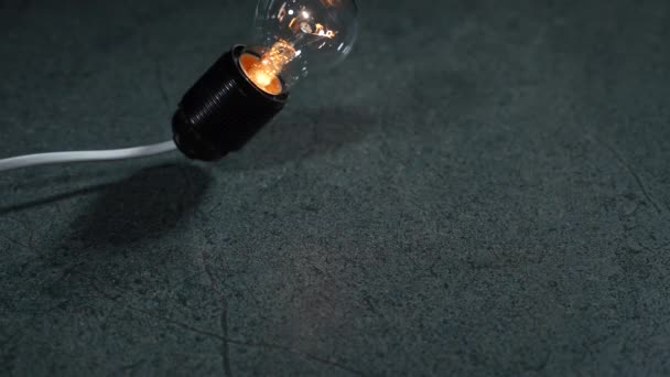 Glowing Electric Lamp Falls Floor Breaks Slow Motion — Stock Video