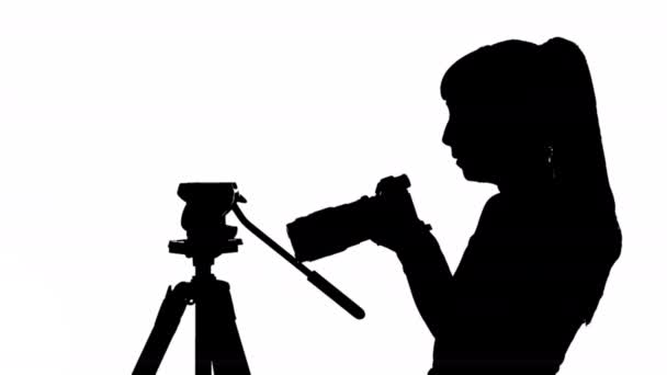 Black Silhouette Videographer Girl Camera Tripod White Background Black White — Stock Video