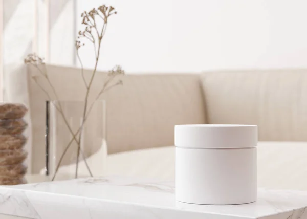 White and blank, unbranded cosmetic cream jar standing on the table at home. Skin care product presentation. Elegant mockup. Skincare, beauty and spa. Jar with copy space. 3D rendering